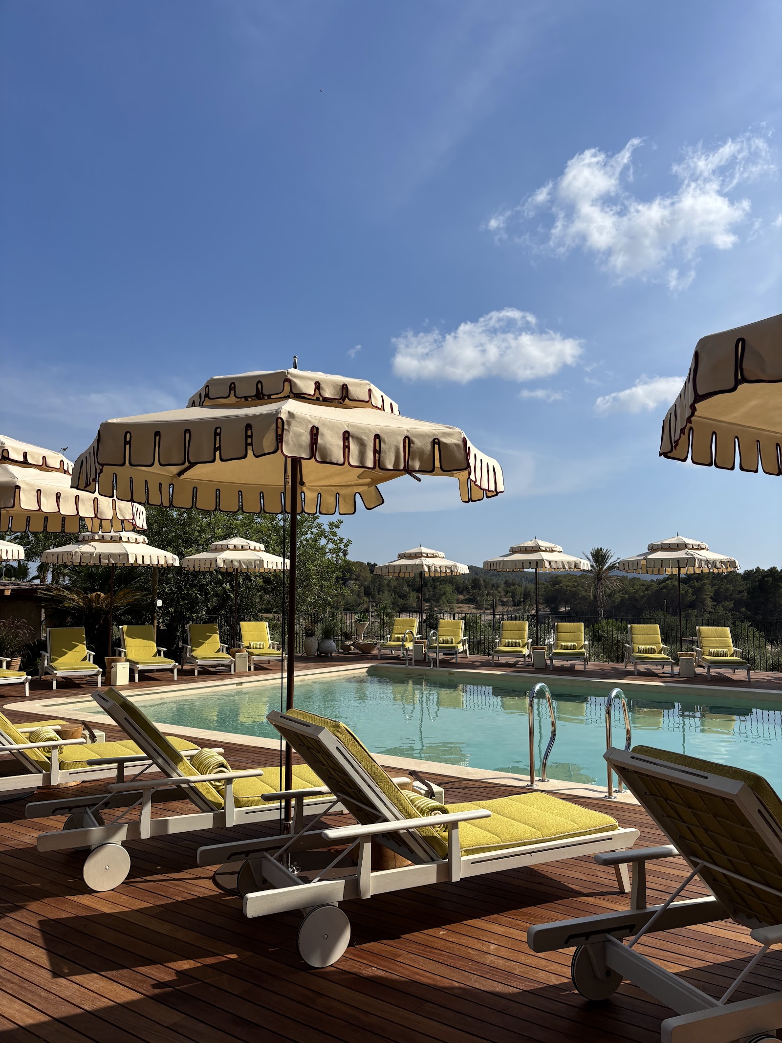Heated pool deck looking over the countryside at Soho Farmhouse Ibiza, formerly Cas Gasi, near Santa Gertrudis