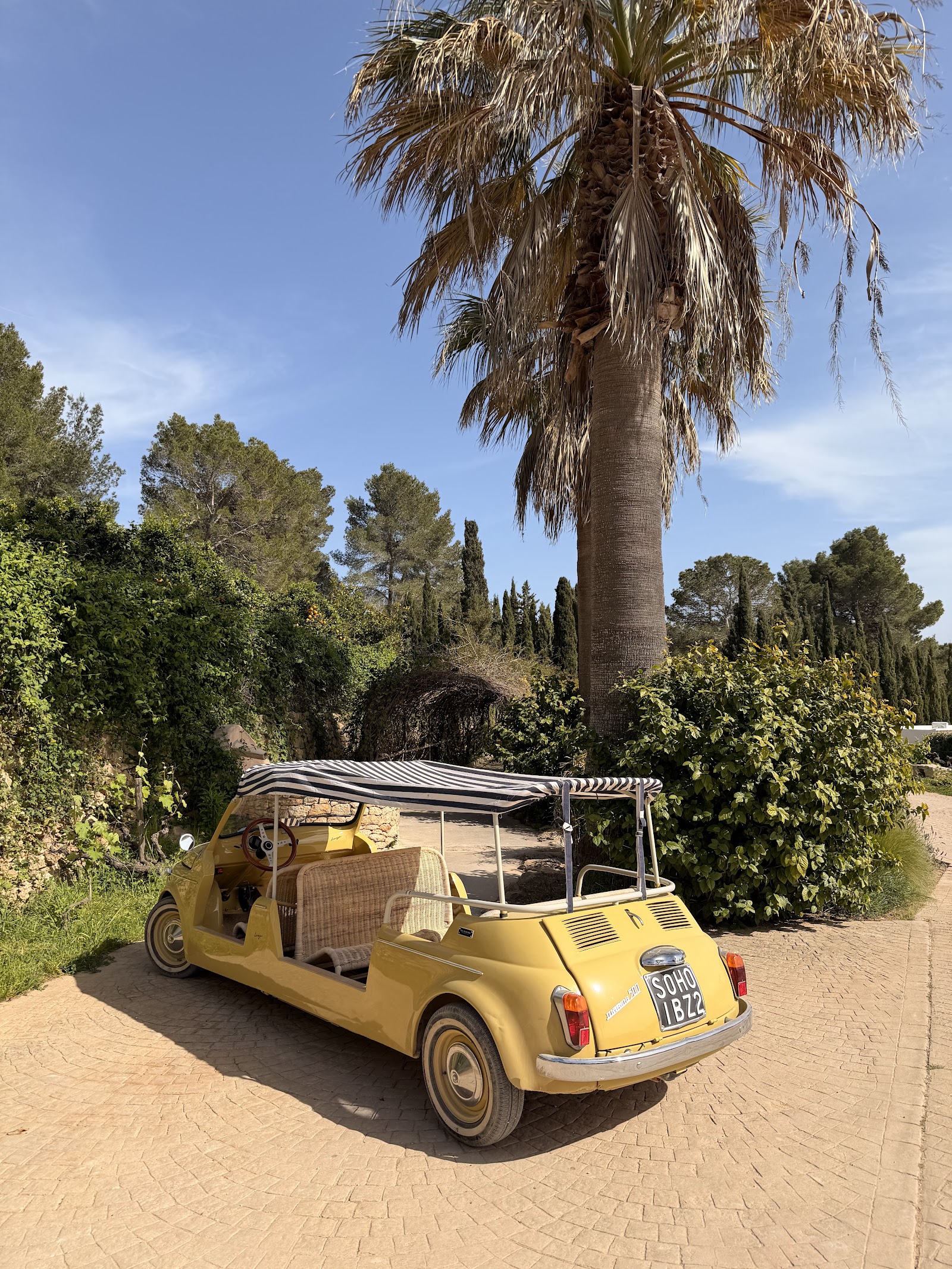 Vintage open-top house car on the driveway of the former Cas Gasi estate, now Soho Farmhouse Ibiza, Santa Gertrudis