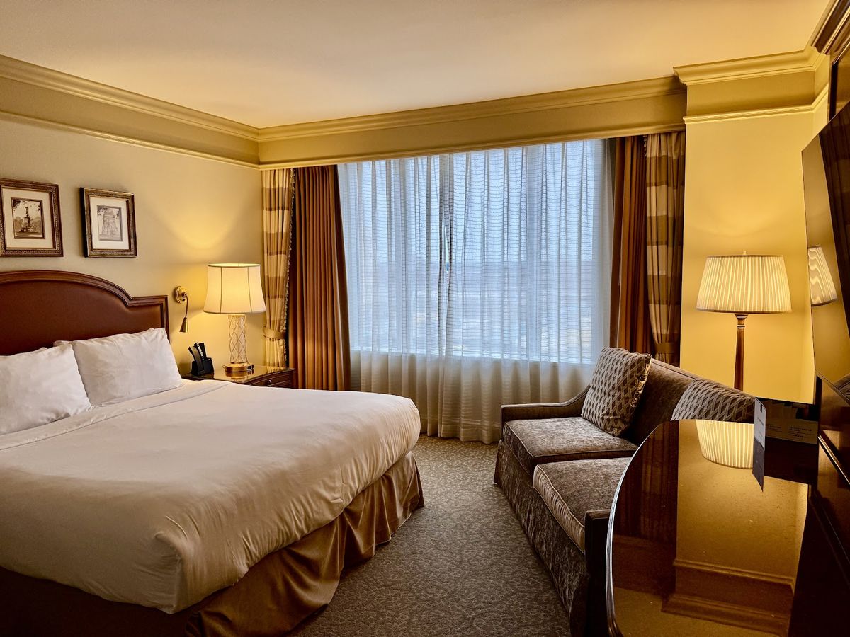 Conrad Indianapolis guest room with marble bathroom and downtown views