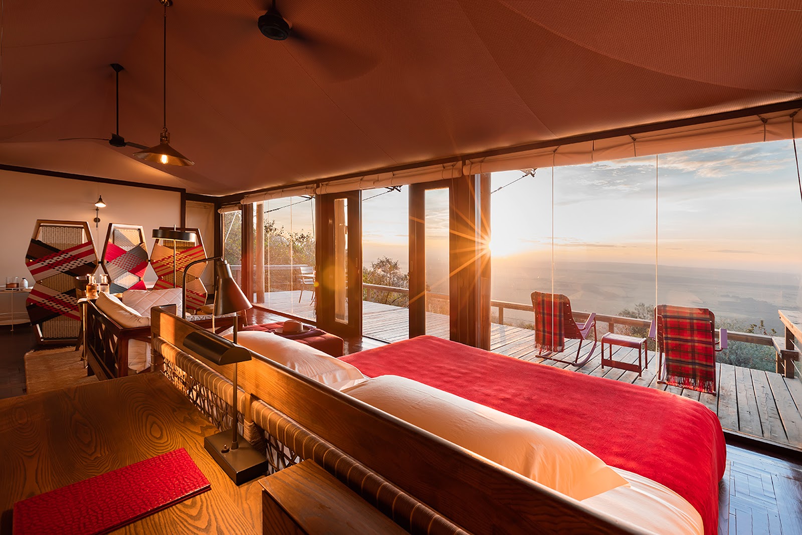 Glass-fronted tented suite at sunrise at Angama Mara, on the Oloololo Escarpment above the Mara Triangle, Kenya
