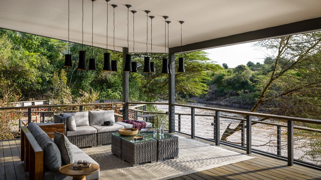 Open-sided riverfront deck overlooking the Mara River at Olonana Lodge, an A&K Sanctuary, Masai Mara, Kenya