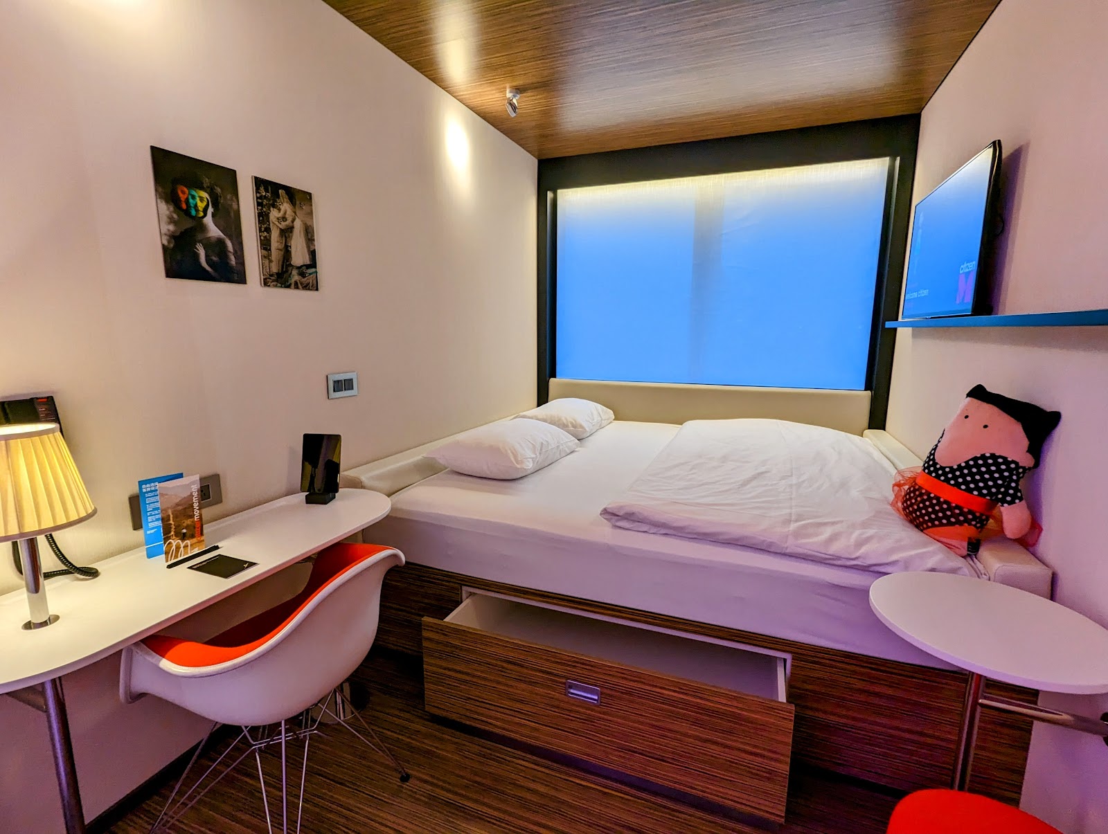 citizenM compact design room with wall-to-wall window and XL bed