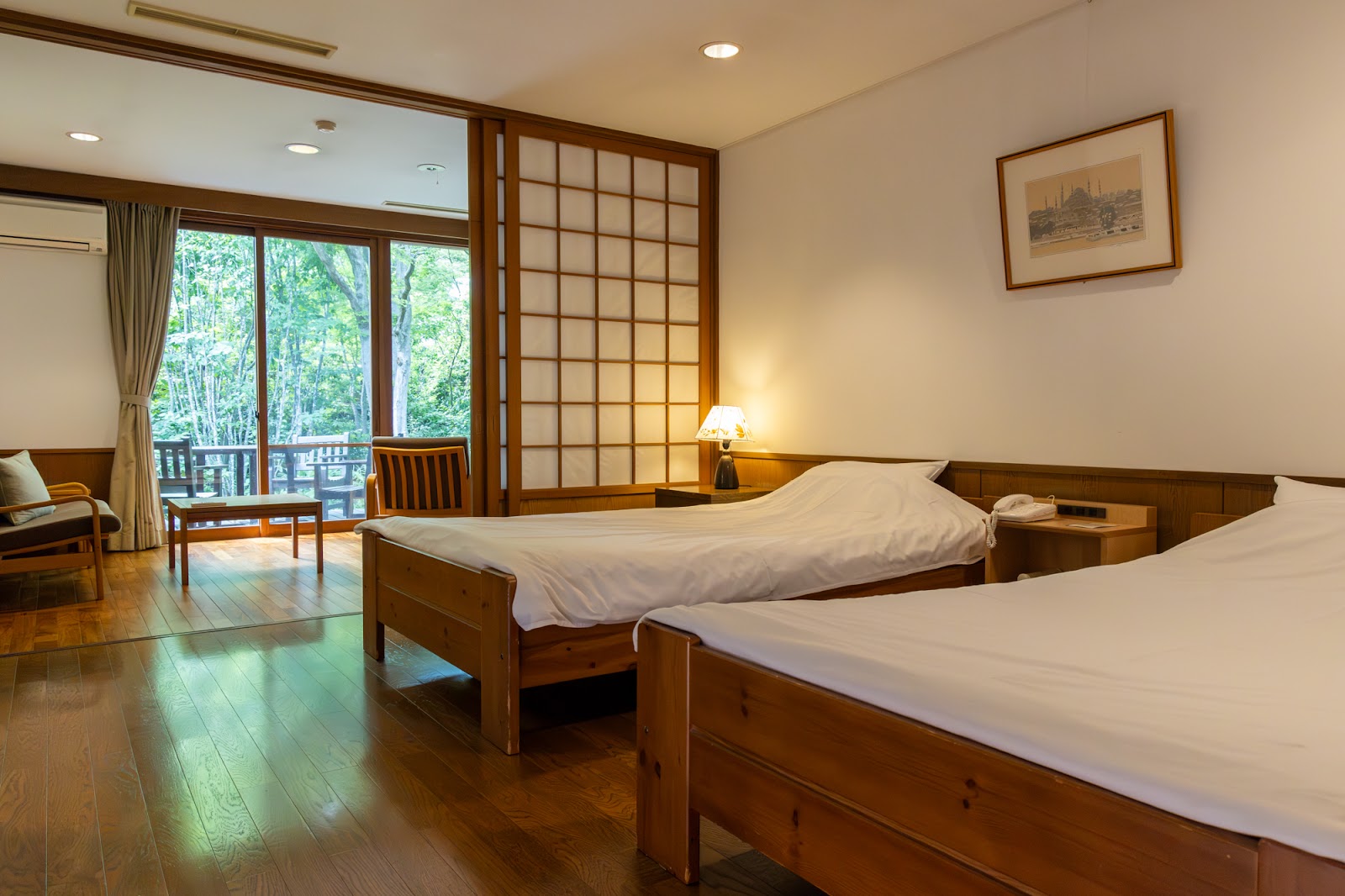 Tatami room with shoji screens at a Japanese ryokan